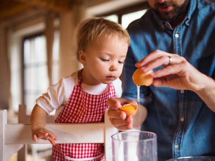 Kid baking with dad